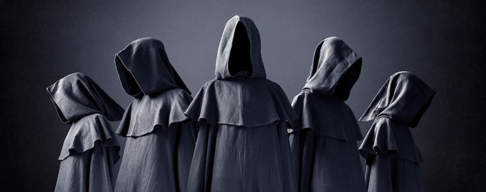 Five hooded figures
