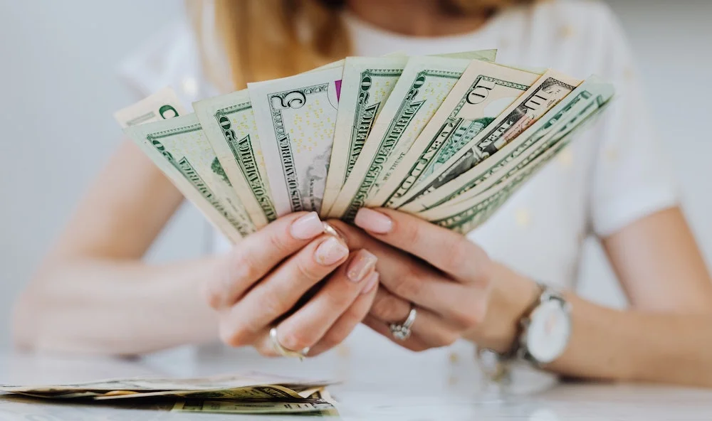 Woman holding cash