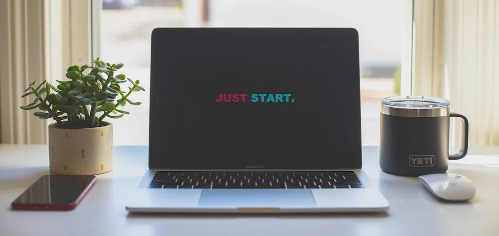 Laptop computer with Just Start displayed on the screen