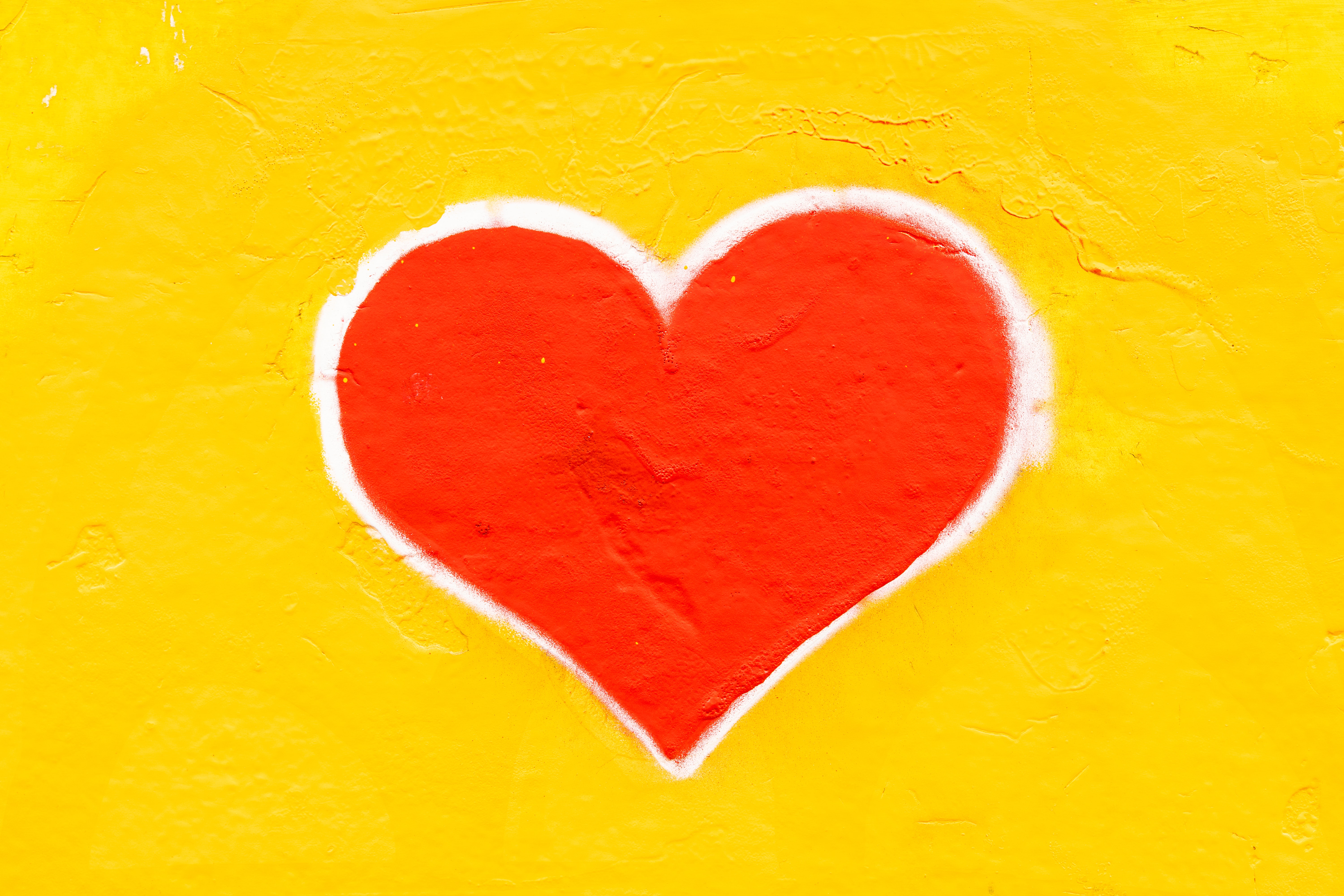Heart painted on yellow wall
